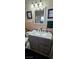 Bathroom with vanity sink, grey cabinets, and tiled floor at 2600 E Bonanza Rd, Las Vegas, NV 89101