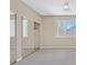 Spacious bedroom with mirrored closet doors and ceiling fan at 2687 Hollowvale Ln, Henderson, NV 89052