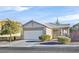 One-story house with a two-car garage and well-manicured front yard at 2687 Hollowvale Ln, Henderson, NV 89052