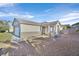 Front view of a single story house with gravel landscaping and a covered entryway at 2687 Hollowvale Ln, Henderson, NV 89052