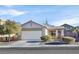 Single story home with attached garage and landscaping at 2687 Hollowvale Ln, Henderson, NV 89052