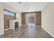 Living room with hardwood floors, fireplace and sliding doors to backyard at 2687 Hollowvale Ln, Henderson, NV 89052