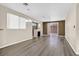 Open living room featuring hardwood floors, a fireplace, and access to the backyard at 2687 Hollowvale Ln, Henderson, NV 89052