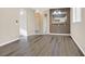 Spacious living room with hardwood floors and a view of the kitchen at 2687 Hollowvale Ln, Henderson, NV 89052