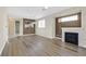 Bright and airy living room with hardwood floors and a fireplace at 2687 Hollowvale Ln, Henderson, NV 89052