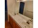 Double vanity bathroom with marble countertop and wood cabinets at 2725 S Nellis Blvd # 1140, Las Vegas, NV 89121