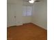 Simple bedroom with wood flooring and window with blinds at 2725 S Nellis Blvd # 1140, Las Vegas, NV 89121