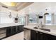 Modern kitchen with dark cabinetry and quartz countertops at 2777 Paradise Rd # 303, Las Vegas, NV 89109