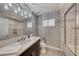 Modern bathroom with a large vanity, soaking tub, and glass shower at 2908 Bryant Ave, Las Vegas, NV 89102