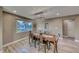 Elegant dining room with wood table and metal chairs, hardwood floors and large window at 2908 Bryant Ave, Las Vegas, NV 89102