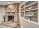 Brick fireplace with built-in shelving at 2908 Bryant Ave, Las Vegas, NV 89102