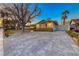 Ranch home with paver driveway and basketball court at 2908 Bryant Ave, Las Vegas, NV 89102