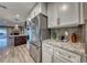 Modern kitchen with stainless steel appliances and white cabinets at 2908 Bryant Ave, Las Vegas, NV 89102