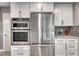 Modern kitchen with stainless steel appliances and white cabinets at 2908 Bryant Ave, Las Vegas, NV 89102