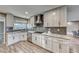 Modern kitchen with white cabinets, granite countertops and stainless steel appliances at 2908 Bryant Ave, Las Vegas, NV 89102