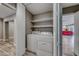 Convenient laundry room with washer, dryer, and shelving at 2908 Bryant Ave, Las Vegas, NV 89102