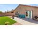 Backyard with patio, fire pit, and artificial turf at 3028 Gannon Ridge Ave, North Las Vegas, NV 89081