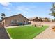 Artificial turf backyard with patio and seating area at 3028 Gannon Ridge Ave, North Las Vegas, NV 89081