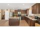 Spacious kitchen featuring an island and dark wood cabinetry at 3028 Gannon Ridge Ave, North Las Vegas, NV 89081