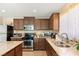 Modern kitchen with stainless steel appliances and granite countertops at 3028 Gannon Ridge Ave, North Las Vegas, NV 89081