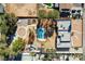 Aerial view of property featuring pool, landscaping, and surrounding buildings at 3070 Mann St, Las Vegas, NV 89146