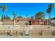 Front view of a ranch-style home with a landscaped yard and walkway at 3070 Mann St, Las Vegas, NV 89146