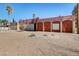 Side view of a ranch-style home with a landscaped yard and walkway at 3070 Mann St, Las Vegas, NV 89146