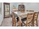 Bright dining room featuring a square table with seating for six at 3614 E Routt Way, Pahrump, NV 89061