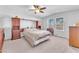 Large main bedroom with built-in wooden cabinets and ceiling fan at 3614 E Routt Way, Pahrump, NV 89061