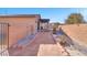 Landscaped side yard with brick walkway and shrubs at 3614 E Routt Way, Pahrump, NV 89061