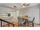 Dining area features a wood table with four chairs and laminate flooring at 3642 Haverhill St, Las Vegas, NV 89121