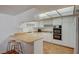 Kitchen with white cabinets, double oven, and breakfast bar at 3642 Haverhill St, Las Vegas, NV 89121