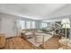 Light and airy living room with L-shaped sofa and hardwood floors at 3642 Haverhill St, Las Vegas, NV 89121