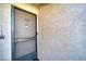 Condo's front door with screen door and number 118 at 3791 Desert Marina Dr # 118, Laughlin, NV 89029