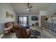 Inviting living room with media shelves, sliding glass doors, and comfortable seating at 3791 Desert Marina Dr # 118, Laughlin, NV 89029