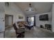 Cozy living room with high ceilings, ceiling fan, large TV and sliding glass doors at 3791 Desert Marina Dr # 118, Laughlin, NV 89029