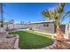 Landscaped backyard featuring artificial turf and a charming pool area at 3809 San Angelo Ave, Las Vegas, NV 89102