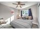 Bedroom with ceiling fan, window, and comfortable seating at 3809 San Angelo Ave, Las Vegas, NV 89102