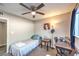 Small bedroom with ceiling fan and workspace at 3809 San Angelo Ave, Las Vegas, NV 89102