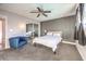 Bedroom featuring a ceiling fan and mirrored closet doors at 3809 San Angelo Ave, Las Vegas, NV 89102