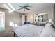 Bright bedroom with ceiling fan and mirrored closet doors at 3809 San Angelo Ave, Las Vegas, NV 89102