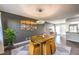 Dining area featuring a wood table and stylish chandelier at 3809 San Angelo Ave, Las Vegas, NV 89102