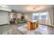 Bright dining area with a wood table and modern chandelier at 3809 San Angelo Ave, Las Vegas, NV 89102