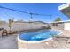 Inviting kidney-shaped pool with patio furniture and string lights at 3809 San Angelo Ave, Las Vegas, NV 89102