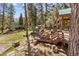 Spacious deck with seating area, surrounded by trees and offering mountain views at 4187 Matterhorn Way, Mount Charleston, NV 89124