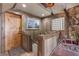 Rustic entryway with wood walls, barn door, and glass block window at 4187 Matterhorn Way, Mount Charleston, NV 89124