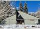 Snow-covered building exterior with American flag, mountain backdrop at 4187 Matterhorn Way, Mount Charleston, NV 89124