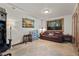 Cozy Gathering room featuring a brown leather sofa and large window at 4187 Matterhorn Way, Mount Charleston, NV 89124