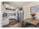 Bright kitchen with white cabinets, granite counters, and stainless steel appliances at 4187 Matterhorn Way, Mount Charleston, NV 89124