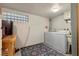 Basement laundry room with washer, dryer, and block window at 4187 Matterhorn Way, Mount Charleston, NV 89124